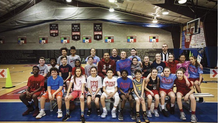 Kevin Houston with Houston's Hoopsters youth basketball team