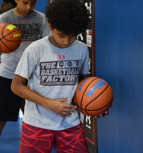 Player practicing ball handling and footwork at TBF
